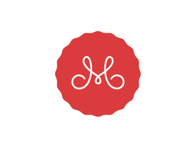 M travis ladue logo.png