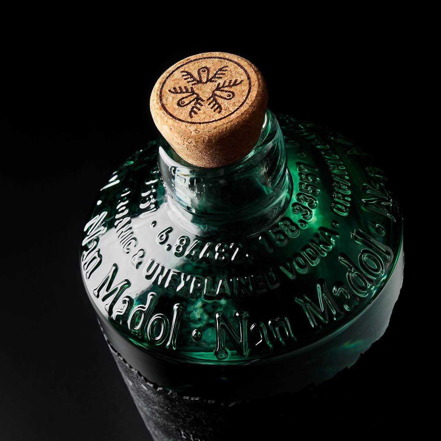 An ecological vodka designed for the @makeamarkproject . On a recycled glass bottle, the label in layers of paper and reliefs, the trunk appears semi-submerged, showing the effects of water on stone. An enigma is revealed in layers as the moisture from the ice cube trays dissolves the paper and uncovers the strange symbologies that tell the story of Nan Madol in the hands of its inhabitants.\\n\\nUn vodka ecológico diseñado para el proyecto @makeamarkproject . Sobre una botella de cristal reciclado,