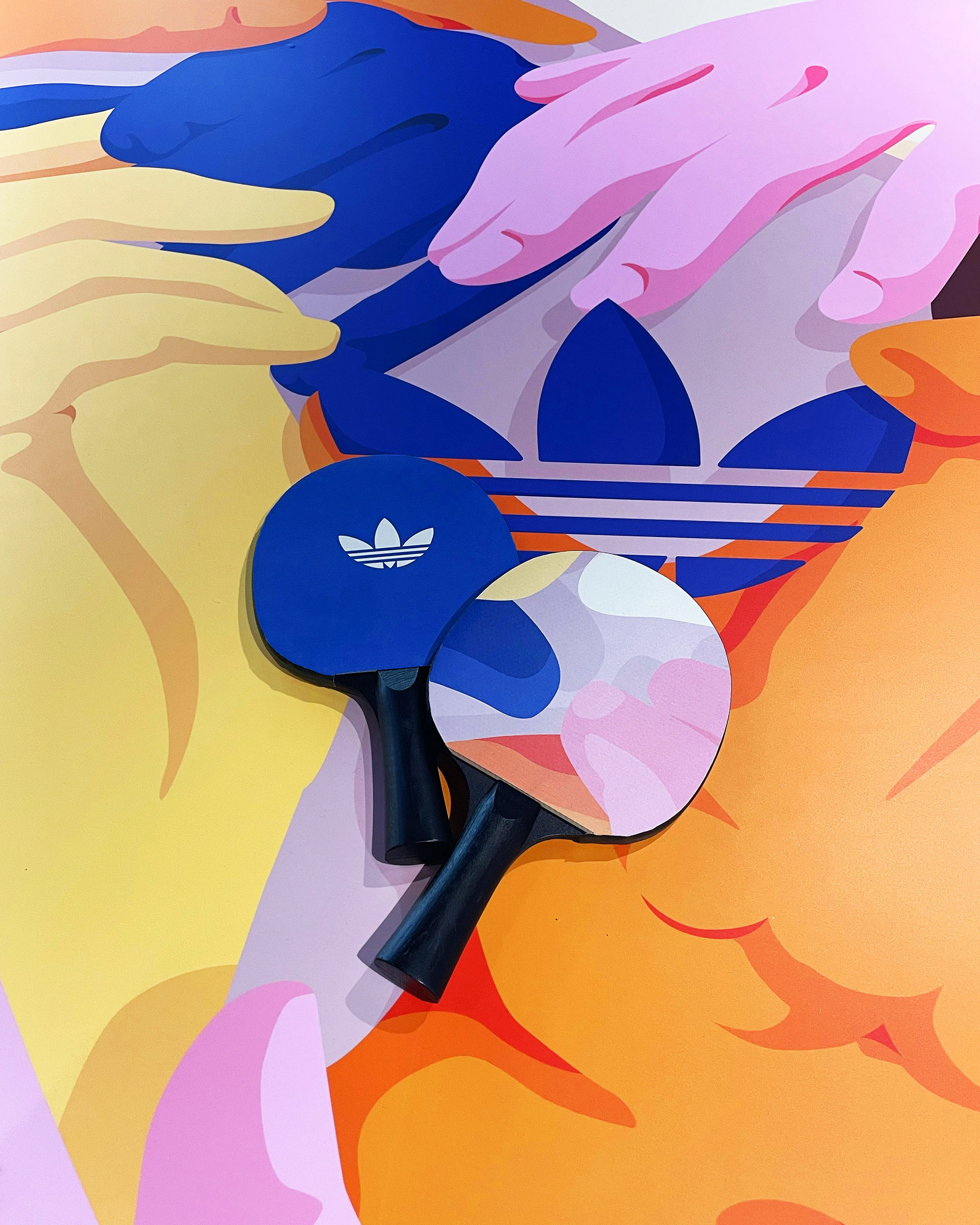 two ping pong paddles placed on a ping pong table.jpg